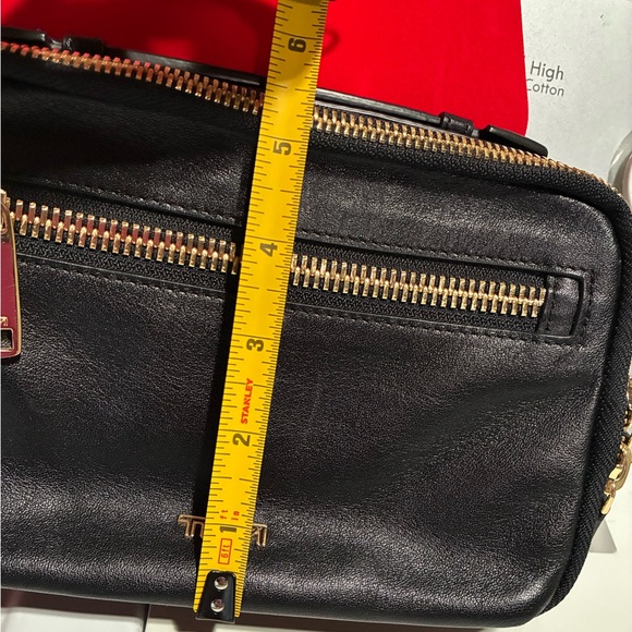 Tumi crossbody bag.
Length is 8.5 inches 
Height is 5.5 inches - Picture 14 of 15